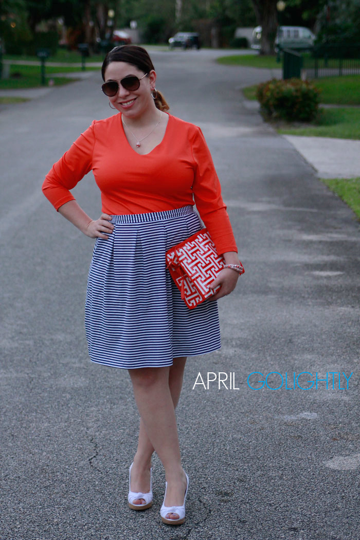 Angela Moore Palm Beach Fashion Outfit with orange annd navy stripes with white wedges and clutch worn by april golightly