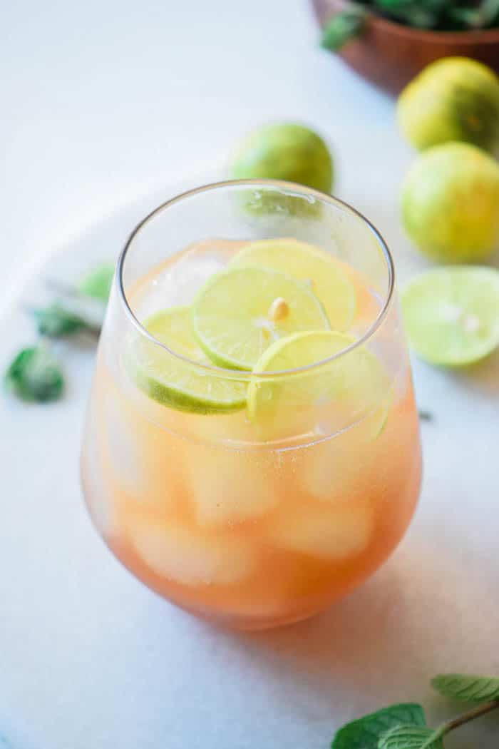 Lime Shandy Beer Cocktails Recipe perfect for summer cocktail party with limes, lime soda, dark beer and ice - light drink recipes