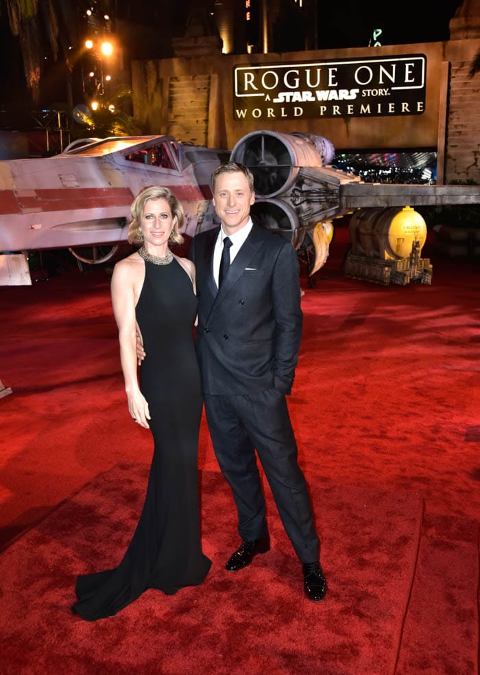 HOLLYWOOD, CA - DECEMBER 10: Actor Alan Tudyk (R) and Charissa Barton attend The World Premiere of Lucasfilm's highly anticipated, first-ever, standalone Star Wars adventure, "Rogue One: A Star Wars Story" at the Pantages Theatre on December 10, 2016 in Hollywood, California. (Photo by Marc Flores/Getty Images for Disney) *** Local Caption *** Alan Tudyk; Charissa Barton