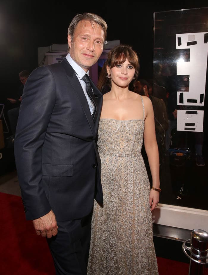 HOLLYWOOD, CA - DECEMBER 10: Actor Mads Mikkelsen (L) and actress Felicity Jones attend The World Premiere of Lucasfilm's highly anticipated, first-ever, standalone Star Wars adventure, "Rogue One: A Star Wars Story" at the Pantages Theatre on December 10, 2016 in Hollywood, California. (Photo by Jesse Grant/Getty Images for Disney) *** Local Caption *** Felicity Jones; Mads Mikkelsen