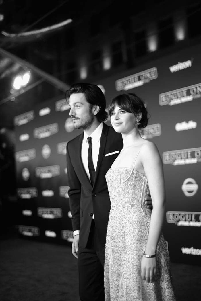 HOLLYWOOD, CA - DECEMBER 10: (EDITORS NOTE: Image has been shot in black and white. Color version not available.) Actors Diego Luna (L) and Felicity Jones attend The World Premiere of Lucasfilm's highly anticipated, first-ever, standalone Star Wars adventure, "Rogue One: A Star Wars Story" at the Pantages Theatre on December 10, 2016 in Hollywood, California. (Photo by Charley Gallay/Getty Images for Disney) *** Local Caption *** Diego Luna; Felicity Jones