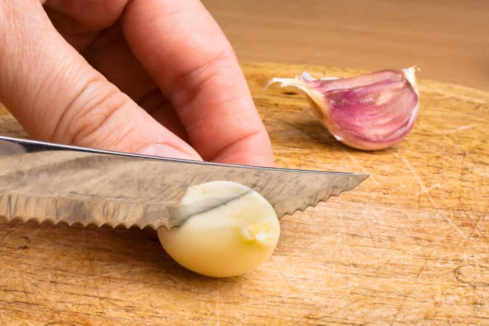 hand slicing garlic