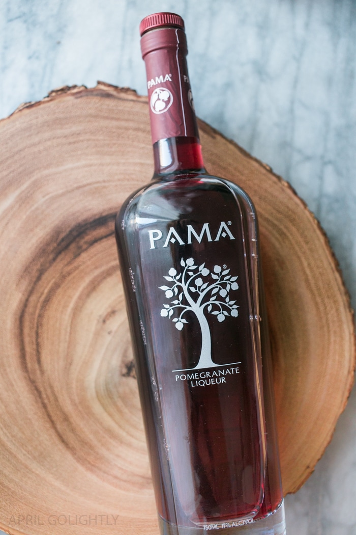 Delicious Pomegranate Moscow Mule Recipe with Pama Liqueur - served in a copper mug with ginger beer, ginger bee, vodka, and pomegranate seeds 