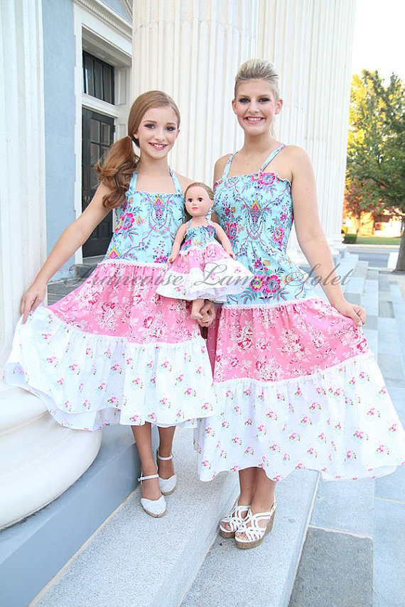 mom and daughter with 18 inch doll matching