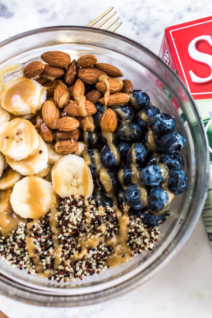 Quinoa Almond Fruit Bowl Recipe that is made with Success Tri-Color 100% Quinoa boil in a bag with sliced banana, blueberries, almonds, almond butter and agave perfect for breakfast. 