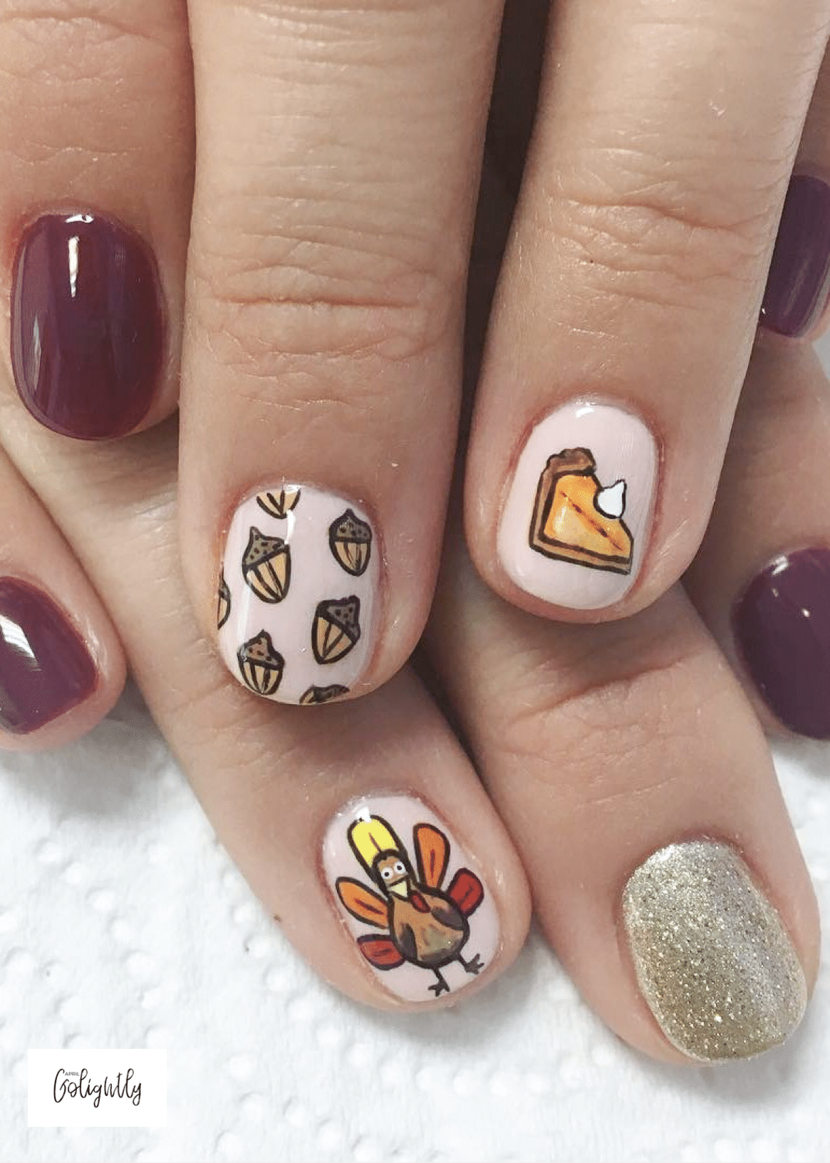 thanksgiving nail art designs ideas with acorns, pumpkin pie, and a turkey 