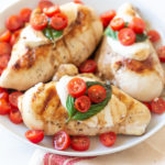 This Grilled Chicken Caprese Salad Recipe is a modification of the original with layers of mozzarella, tomatoes, basil with a balsamic & olive oil drizzle.